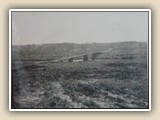 NC 73 Bridge across the Catawba River when they were clearing land for Lake Norman (1962). The road up the hill around the curve came out on NC 16 at the Triangle. The road to the right was Burton Lane.