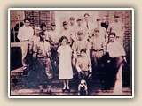 Winifred Readling was chosen as the most attractive girl at the Cornelius High School (1929). Her reward was to have her picture made with the school baseball team.